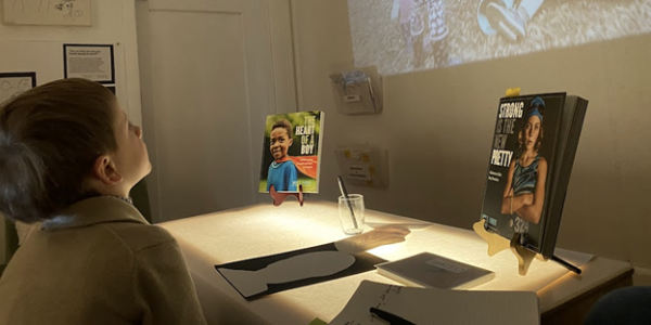 a child watching a film on a projector