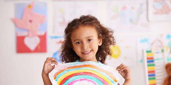 Child holding a drawing