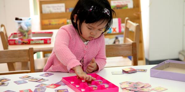 Toddler playing at a table