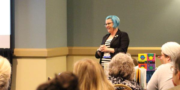 Photograph of a female presenter at Annual Conference.