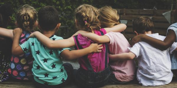 Group of children hugging each other