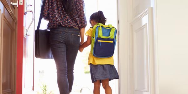 A parent and child leaving school