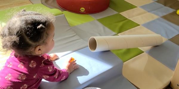 a child playing with a craft in a classroom