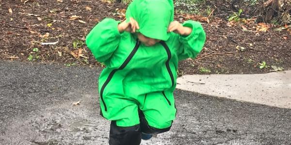 a child playing in the rain