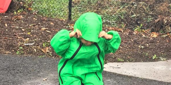 a child playing in the rain