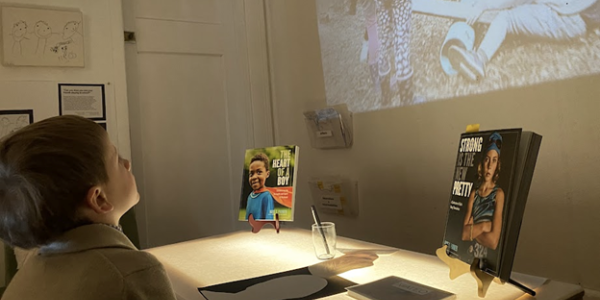 a child watching a film on a projector