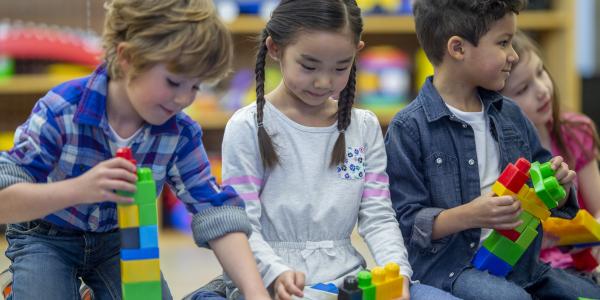 Children playing with blocks in the classroom