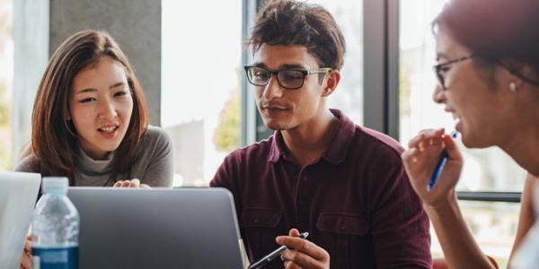 Young professionals working together on a laptop