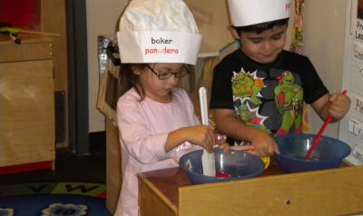 children play baking in classroom