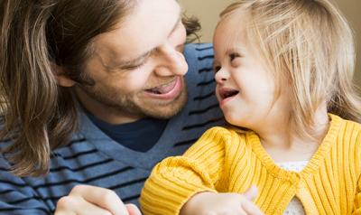 Father and daughter smiling