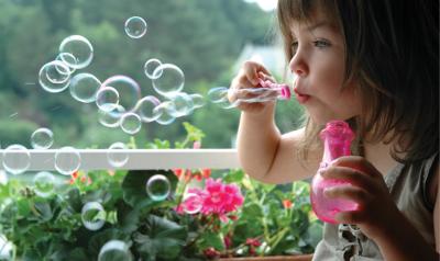 Girl blowing bubbles