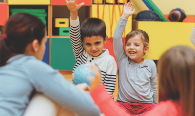 Preschool children in circle in classroom