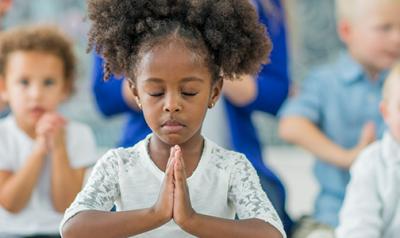 Young girl meditates