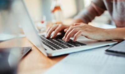 Typing on laptop