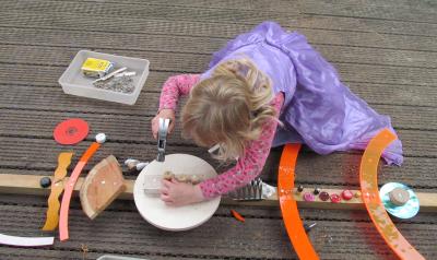 a child working on a wood-based craft