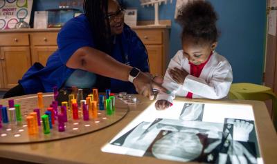 feature teacher beulah wiggins with a student