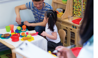 Teacher playing with student during center time