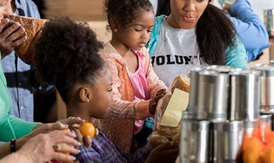 Family helping at a food drive