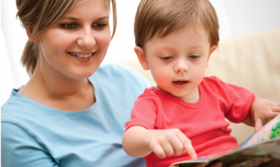 Mom reading a book with her toddler