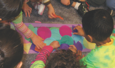 Children working on a stained glass project