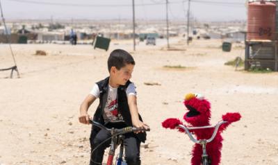 boy with Elmo in Syria