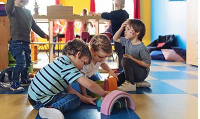 A group of children playing with toys.