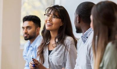 Group of diverse professionals discussing something