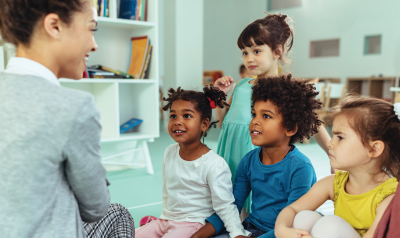 a teacher talking with students