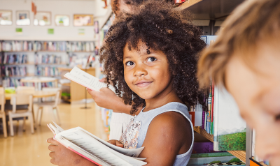 a young girl with a book