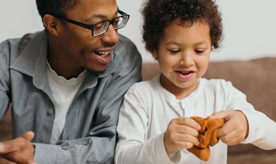 Father and son playing with playdough