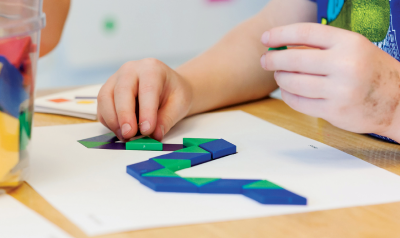 Child playing with shapes