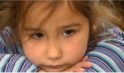 Girl resting her head on her arms