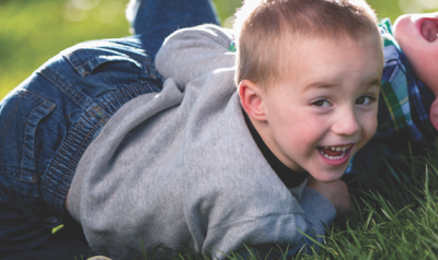 Two children playing outdoors 