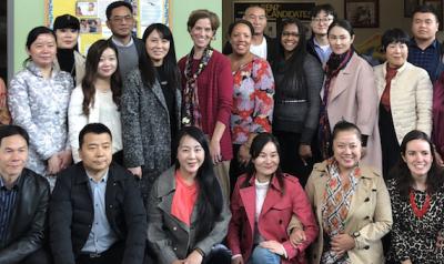 Cotrainers Dr. Nili Luo and Dr. Lea Ann Christenson with a group of teachers, directors, and investors from China