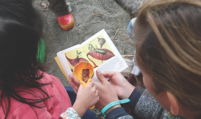 Teacher and student at a preschool in the park