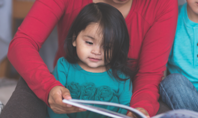 Family reading a book