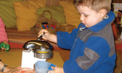 a child playing with toys at a table