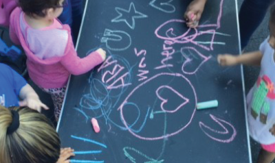 children making a chalk drawing