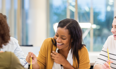 Coworkers laughing in a meeting