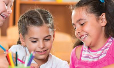 Four children writing