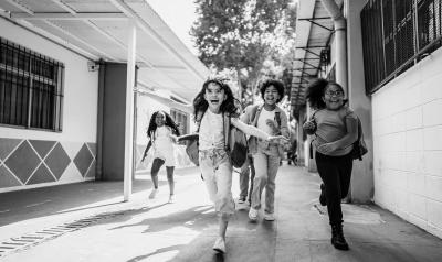 Children running outside at school