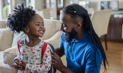 A father and daughter getting ready for school