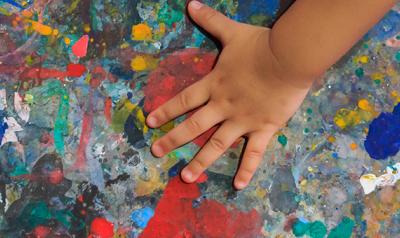 A child playing with paint