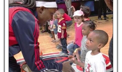 Children meeting WNBA players