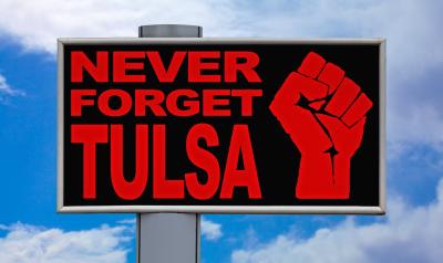 a sign that says "never forget tulsa"