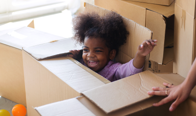a child playing in a box