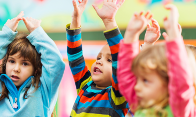 children with their hands in the air