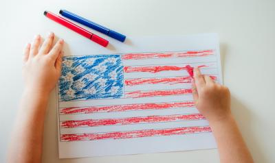 child drawing an american flag