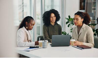 A group of women at a conference table