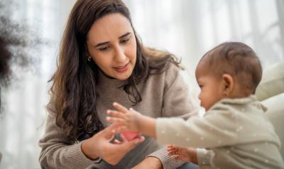 A teaching working with a toddler